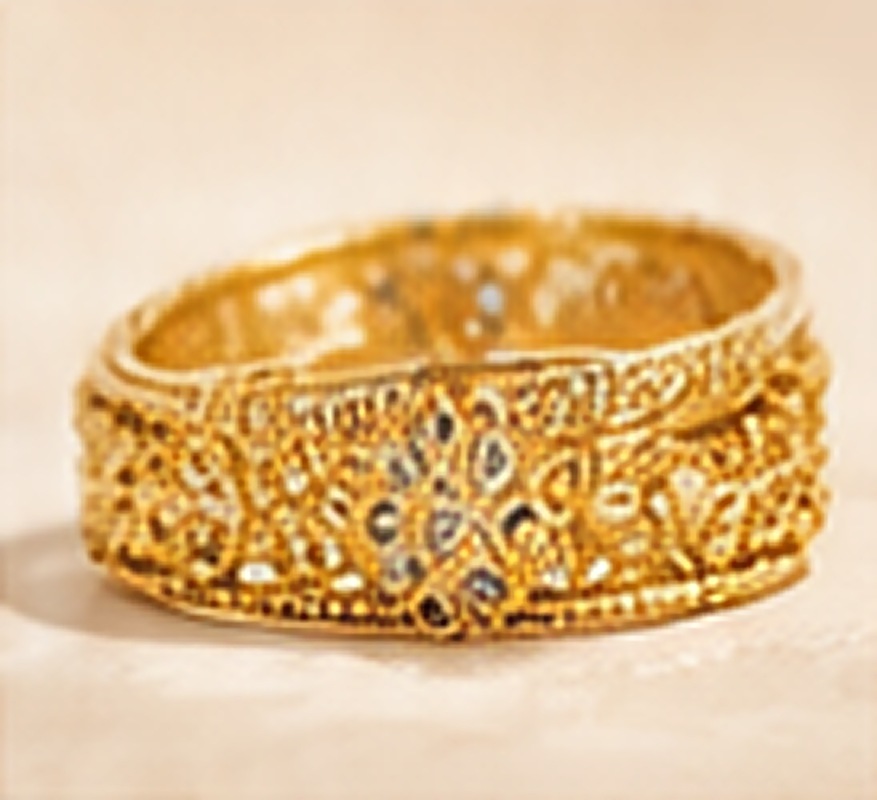 Openwork carving with tiny kundan stones.