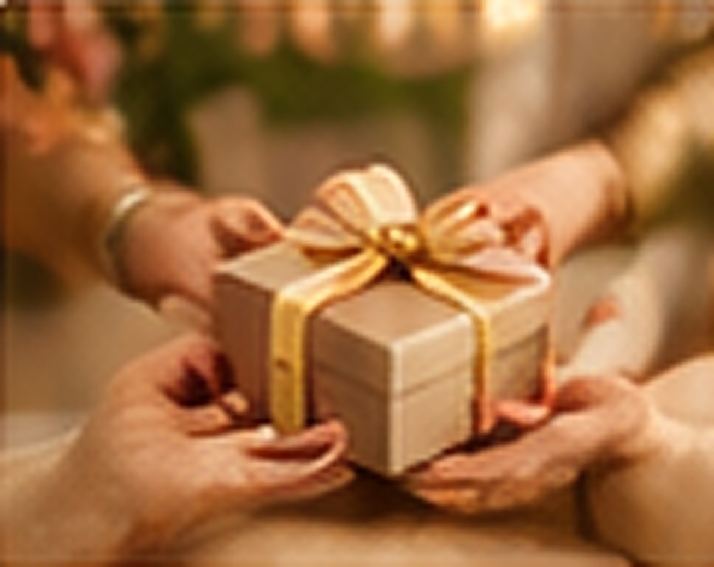 Hands exchanging a gift box